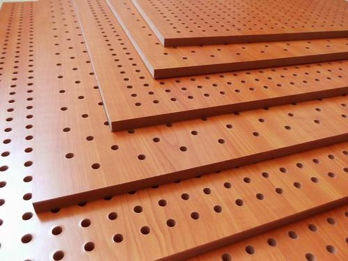 What is the sound absorption principle of hole wood sound-absorbing panels?